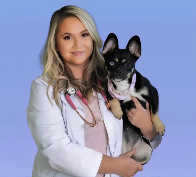 Woman in a white coat holding a small black dog with one blue and one brown eye, against a blue background. MagnaWave